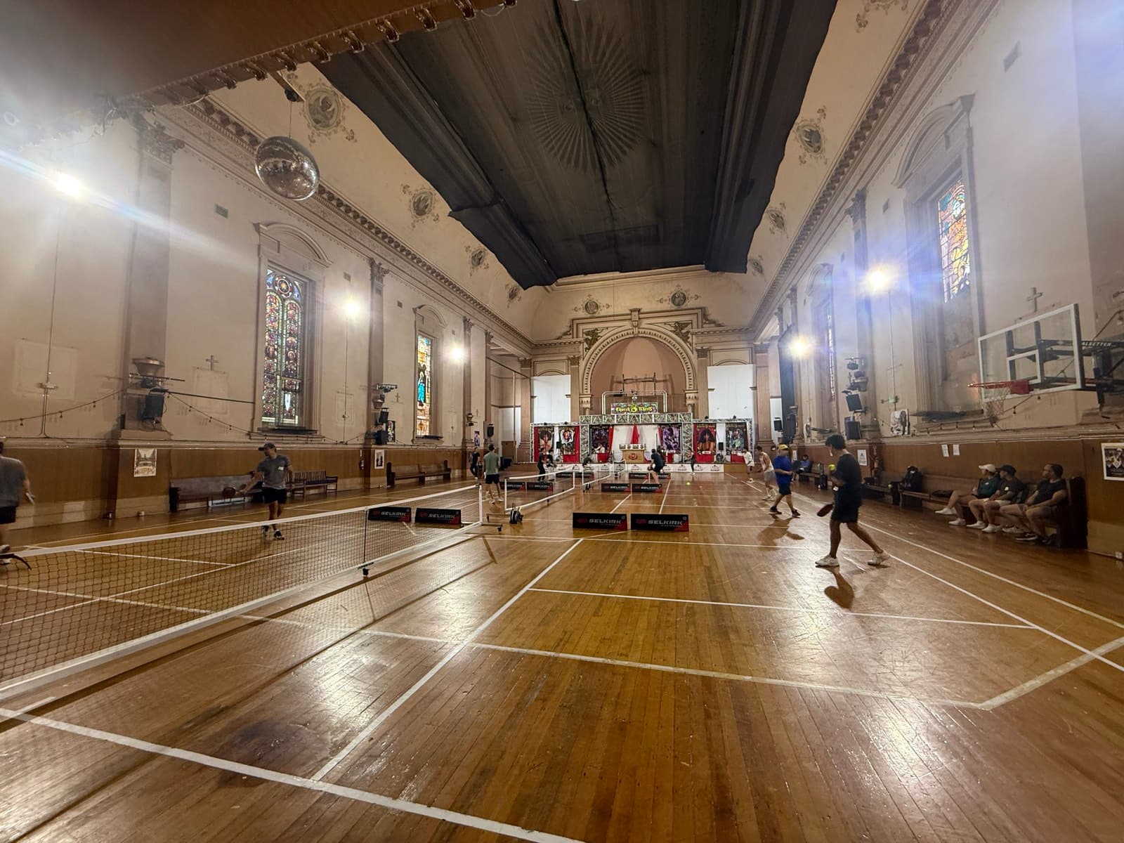 Indoor pickleball courts inside DinkSF's converted church on Fillmore